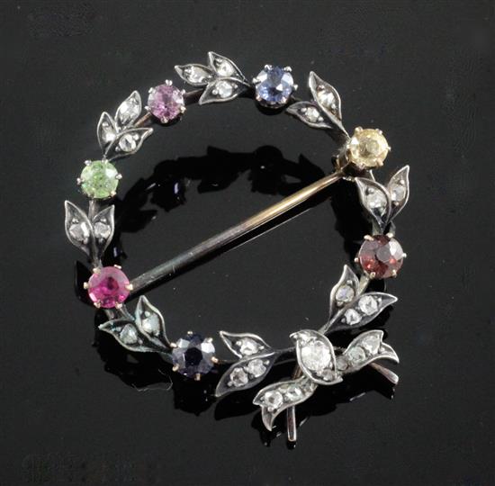 A 19th century gold and silver, rose cut diamond and multi coloured gem set circular garland brooch, 35mm.